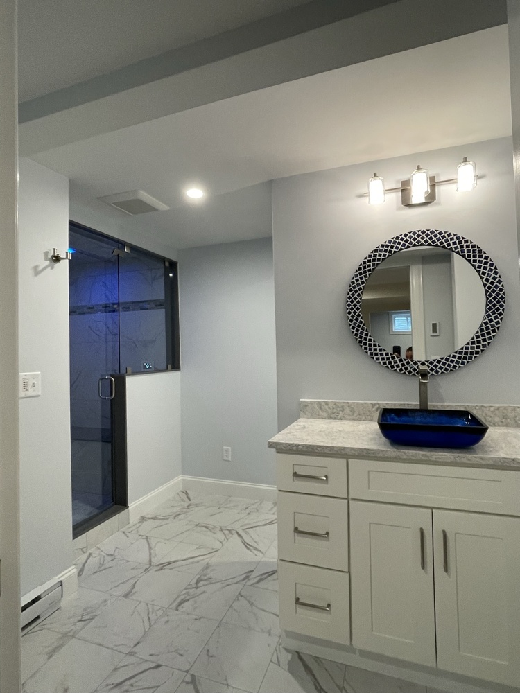 BelPort Building & Remodeling basement remodeling Hyannis MA finished basement bathroom with vanity and glass shower