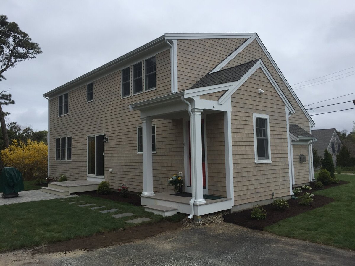 completed home exterior with entryway and landscaping in Chatham by BelPort Building & Remodeling