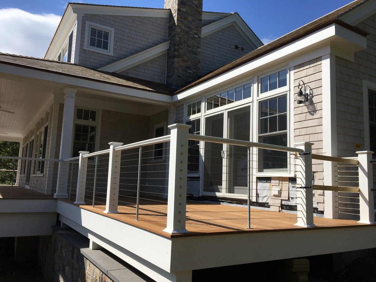 BelPort Building & Remodeling deck and railing installation for outdoor living space overlooking yard in Chatham MA