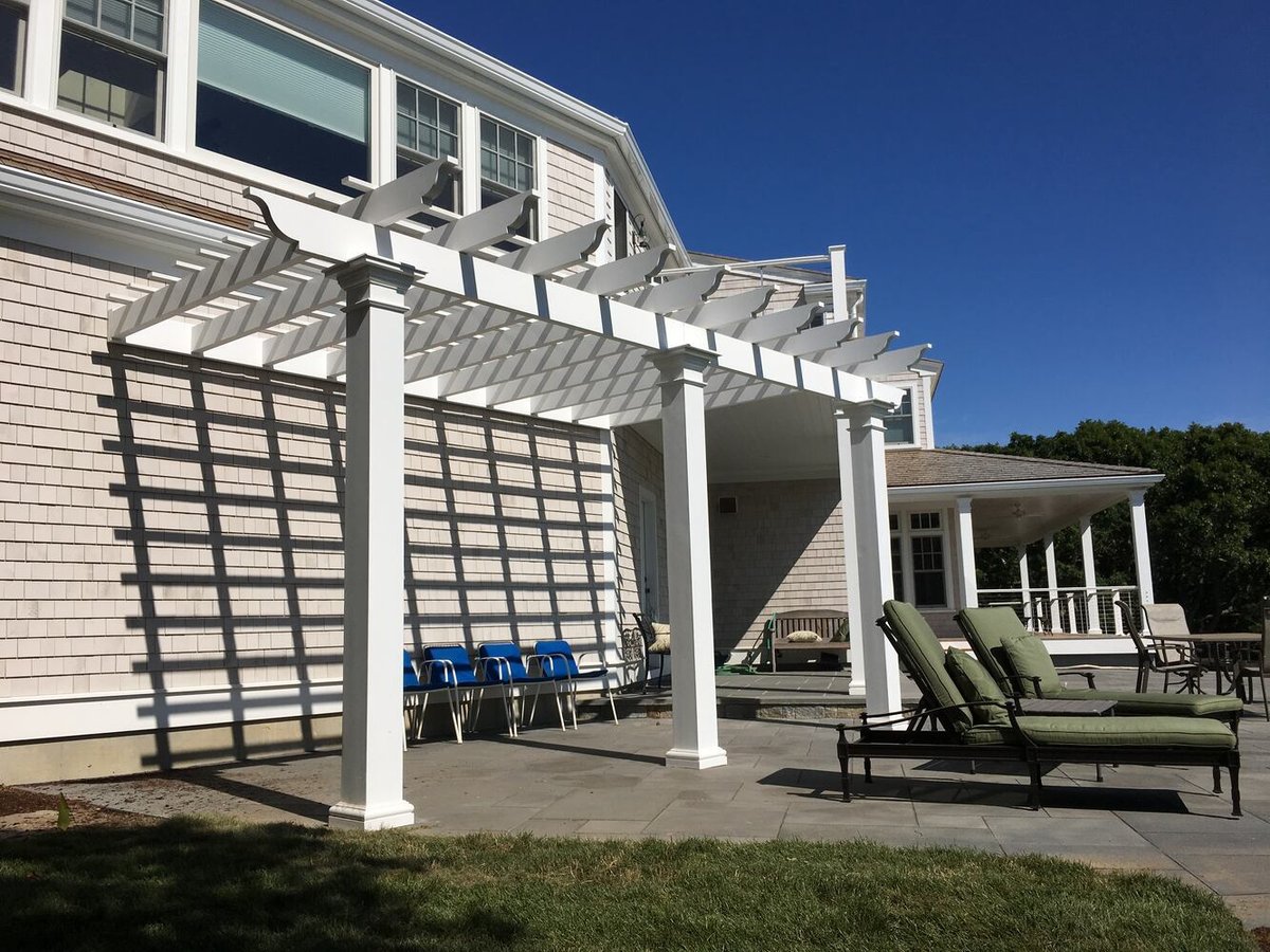 custom pergola outdoor living space with seating area in Barnstable, MA by BelPort Building & Remodeling