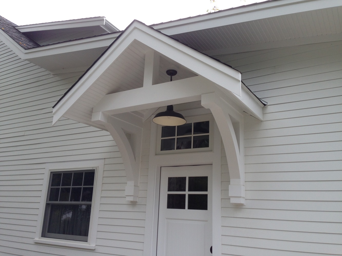 BelPort Building & Remodeling additions Barnstable MA custom home exterior entryway with covered porch and white trim details
