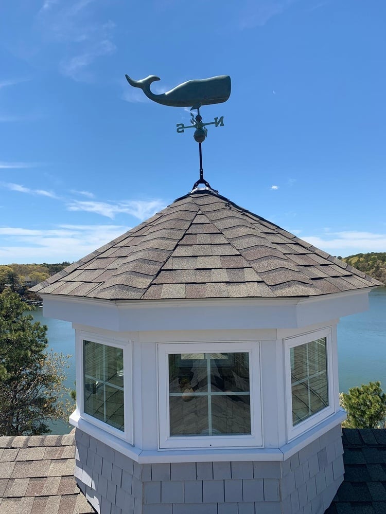 coastal custom home roof detail with cupola and weathervane by BelPort Building & Remodeling in New Seabury, MA